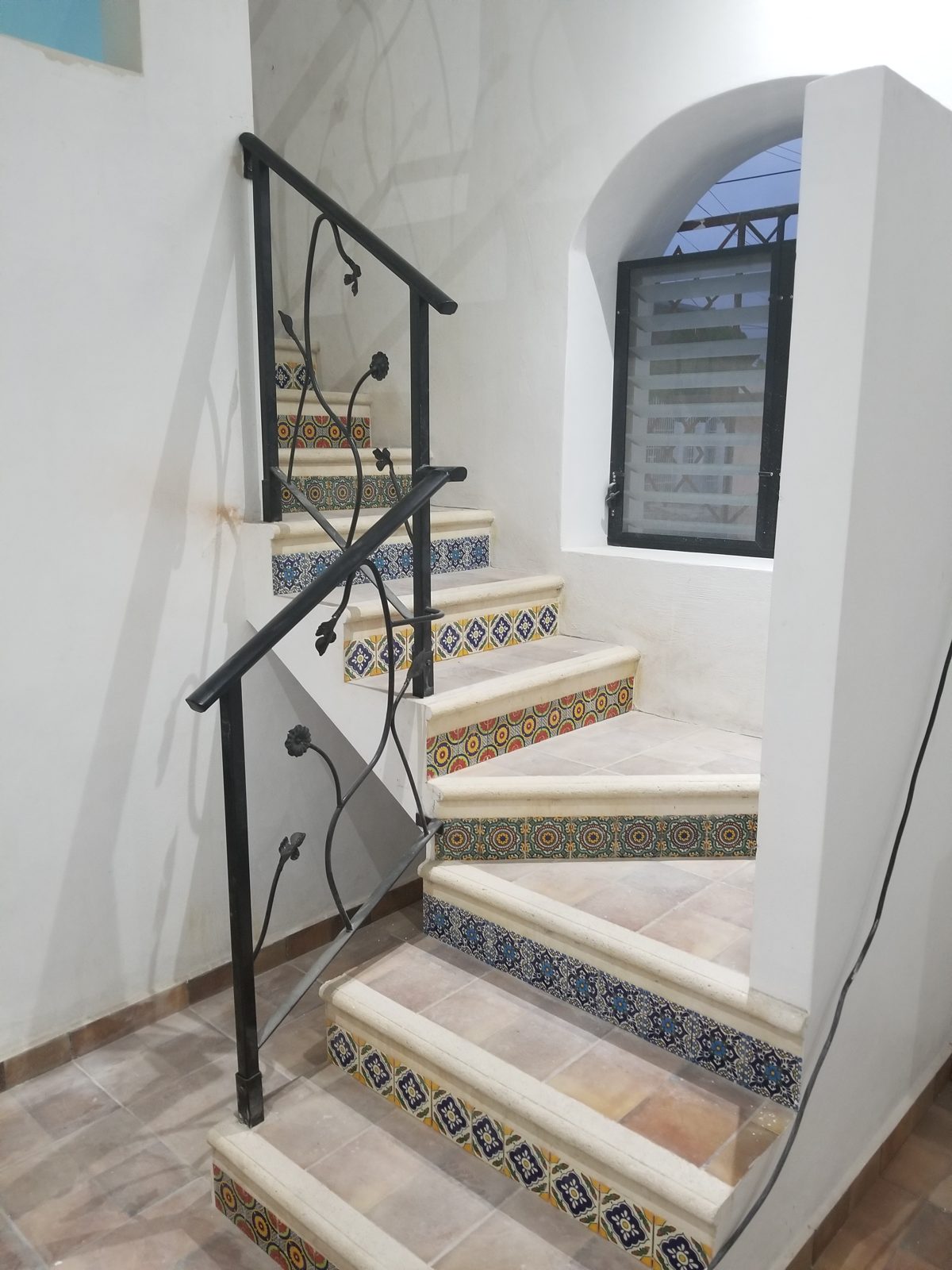 Talavera-tiled staircase in a Mérida home